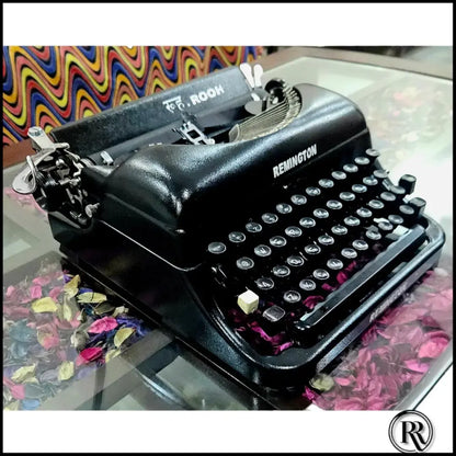 Angled view of Remington Rand Deluxe Portable Typewriter, imported American typing machine for writers
