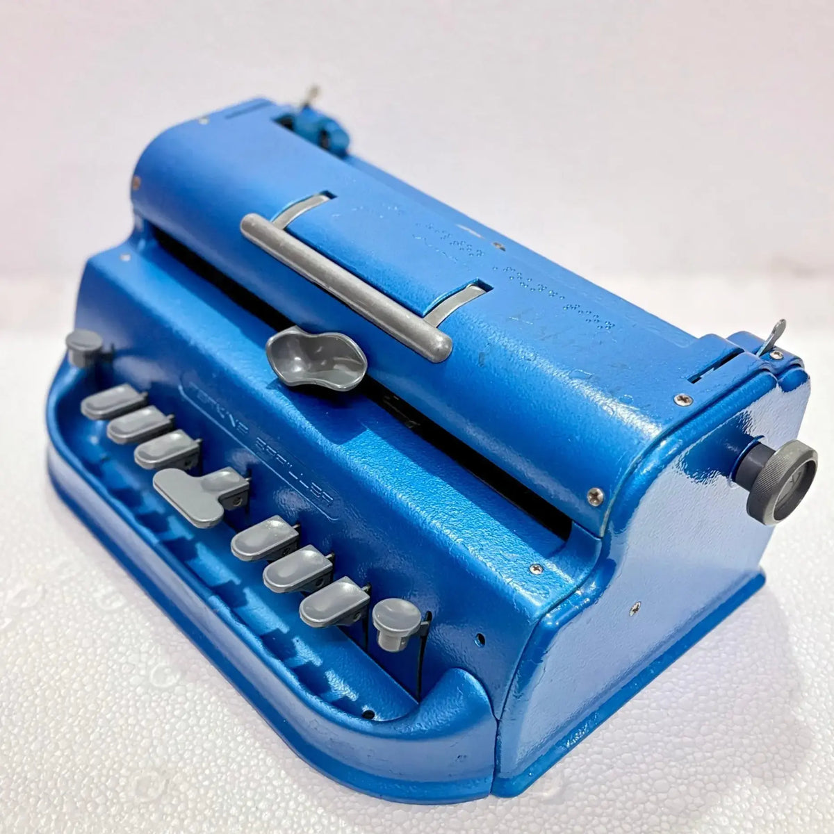 Angled view of Perkins Braille Typewriter, imported Braille typing machine from trusted Braille Typewriter Seller
