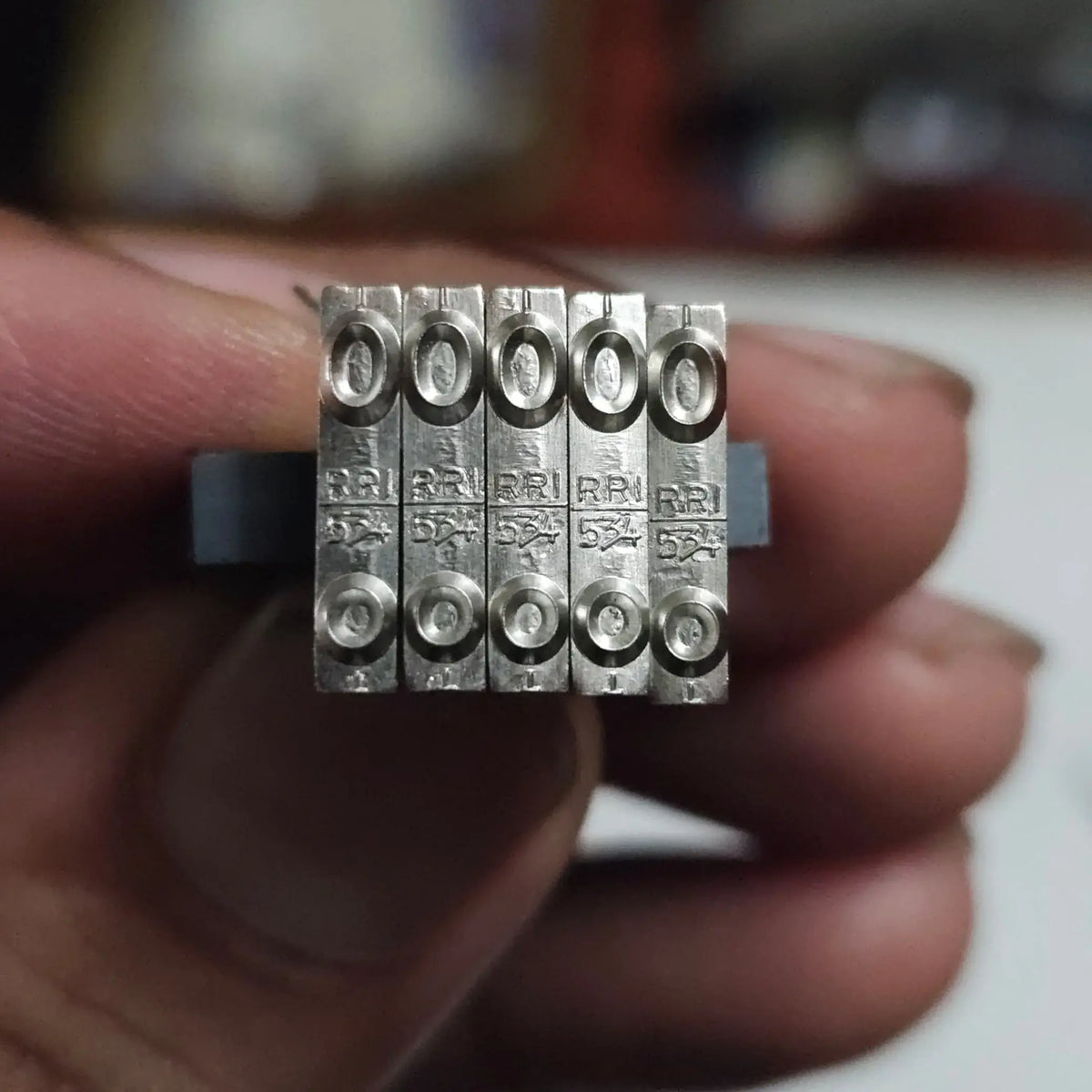 Close-up of English Long Motion Typeface O type slug for restoring crisp typewriter impressions and character clarity