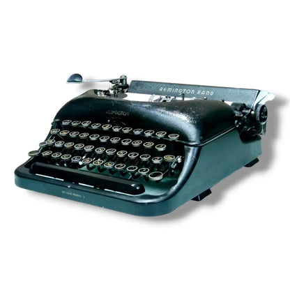 Front left angle of Remington Rand Deluxe Model 5 Royal typewriter at RR Typewriter Mart, portable typing machine