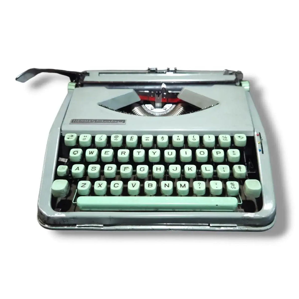 Front view of Hermes Baby Typewriter with mint keys, compact manual English typing machine for writers and collectors