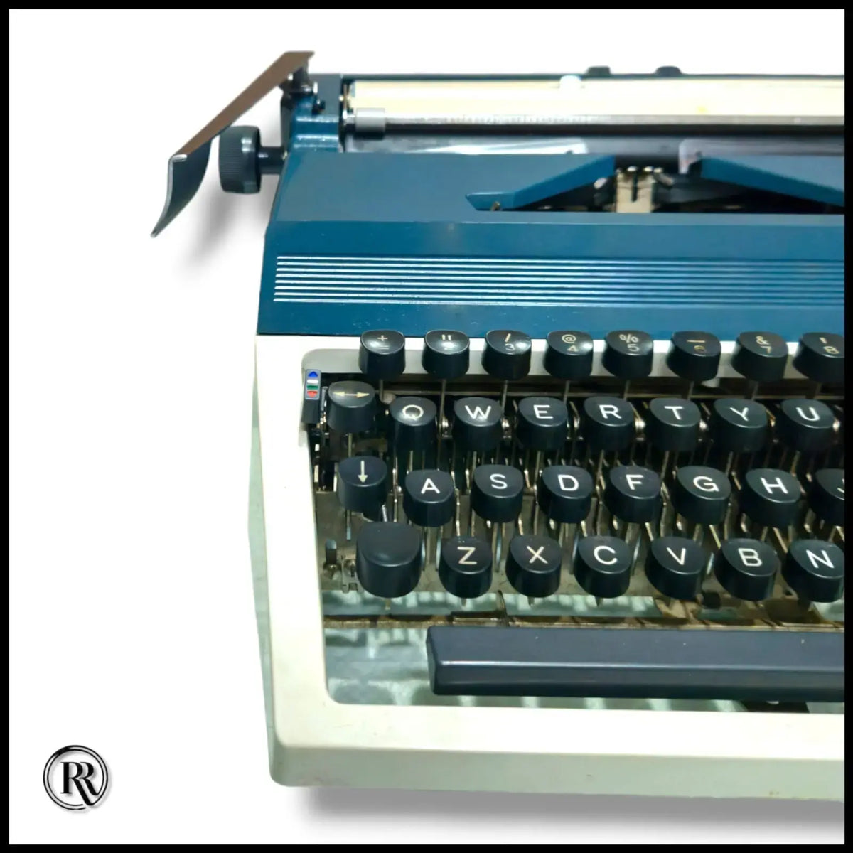Erika portable typing machine side view, imported German typewriter from RR Typewriter Mart