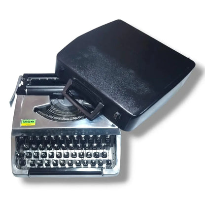 Brother 100 Deluxe chrome typewriter with black carry case, portable English typing machine for writers and collectors