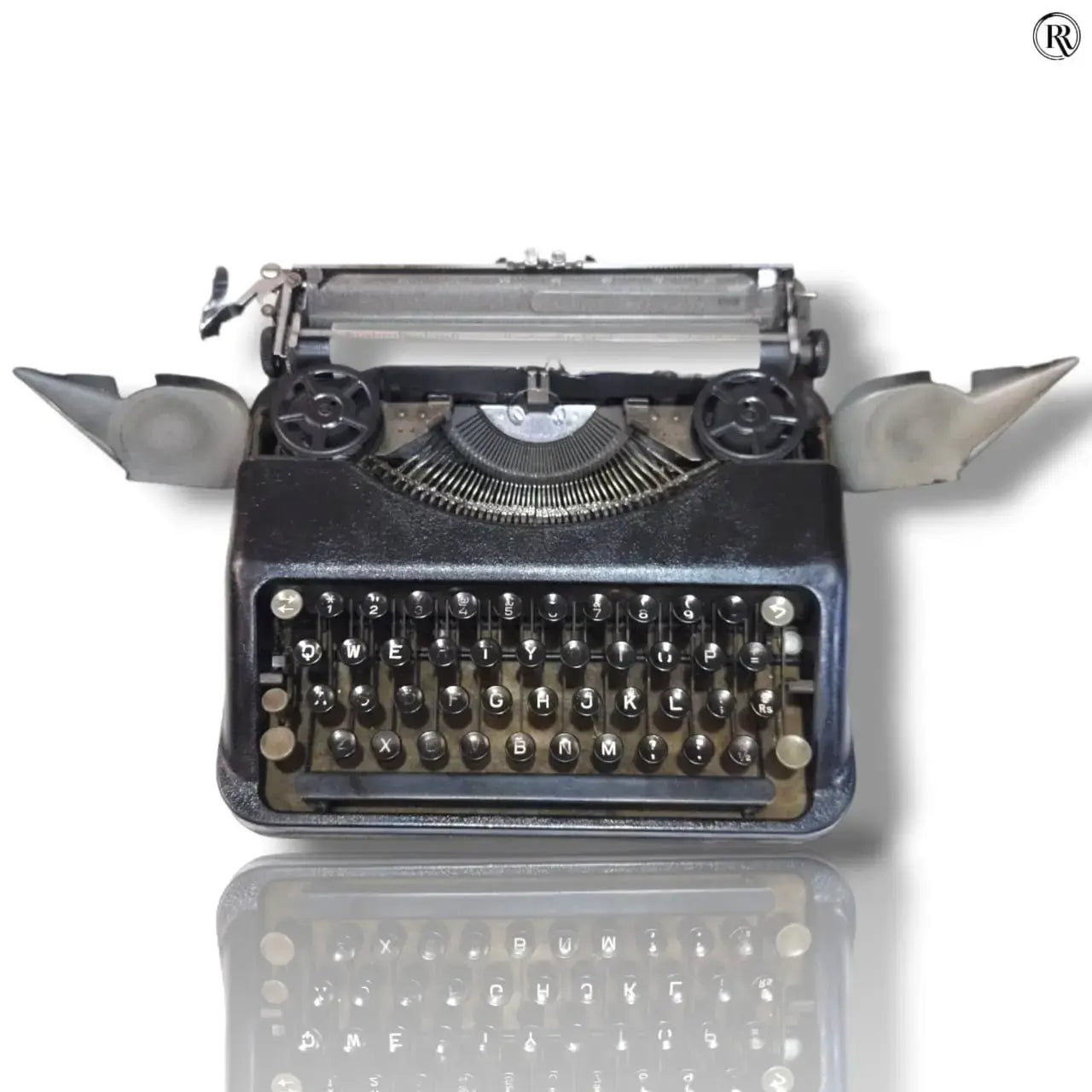Open black Hermes Baby typewriter showing ribbon spools, manual English typing machine offered by RR Typewriter Mart