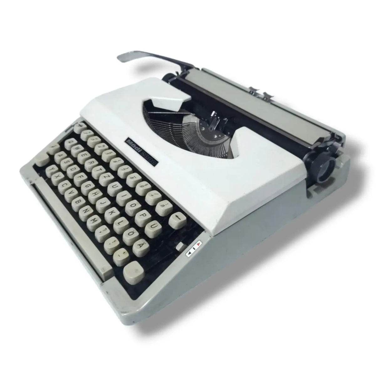 Close-up view of the exquisite ivory keys on the Madi 2000 typewriter