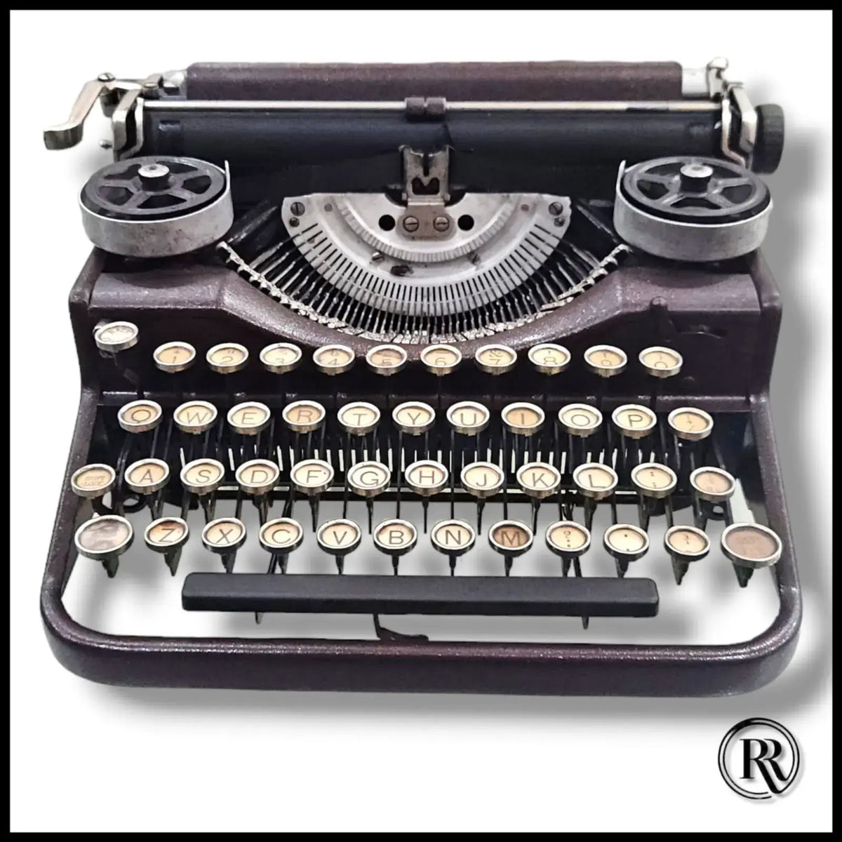 Underwood portable typing machine with round keys, vintage American typewriter shop piece by RR Typewriter Mart