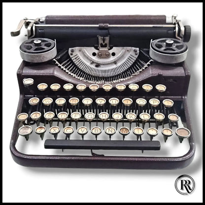 Underwood portable typing machine with round keys, vintage American typewriter shop piece by RR Typewriter Mart