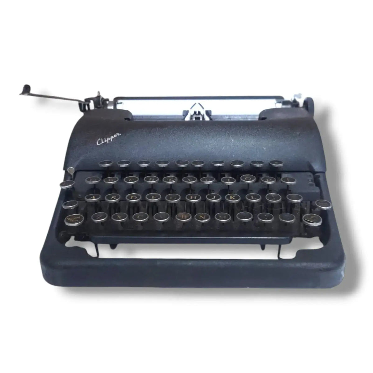 Smith Corona Clipper portable typewriter front view showing black finish, round keys and compact vintage construction