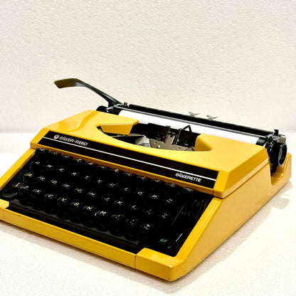 Angled mustard Silver Reed Typewriter, Manual English Typewriter at RR Typewriter Mart typewriter seller