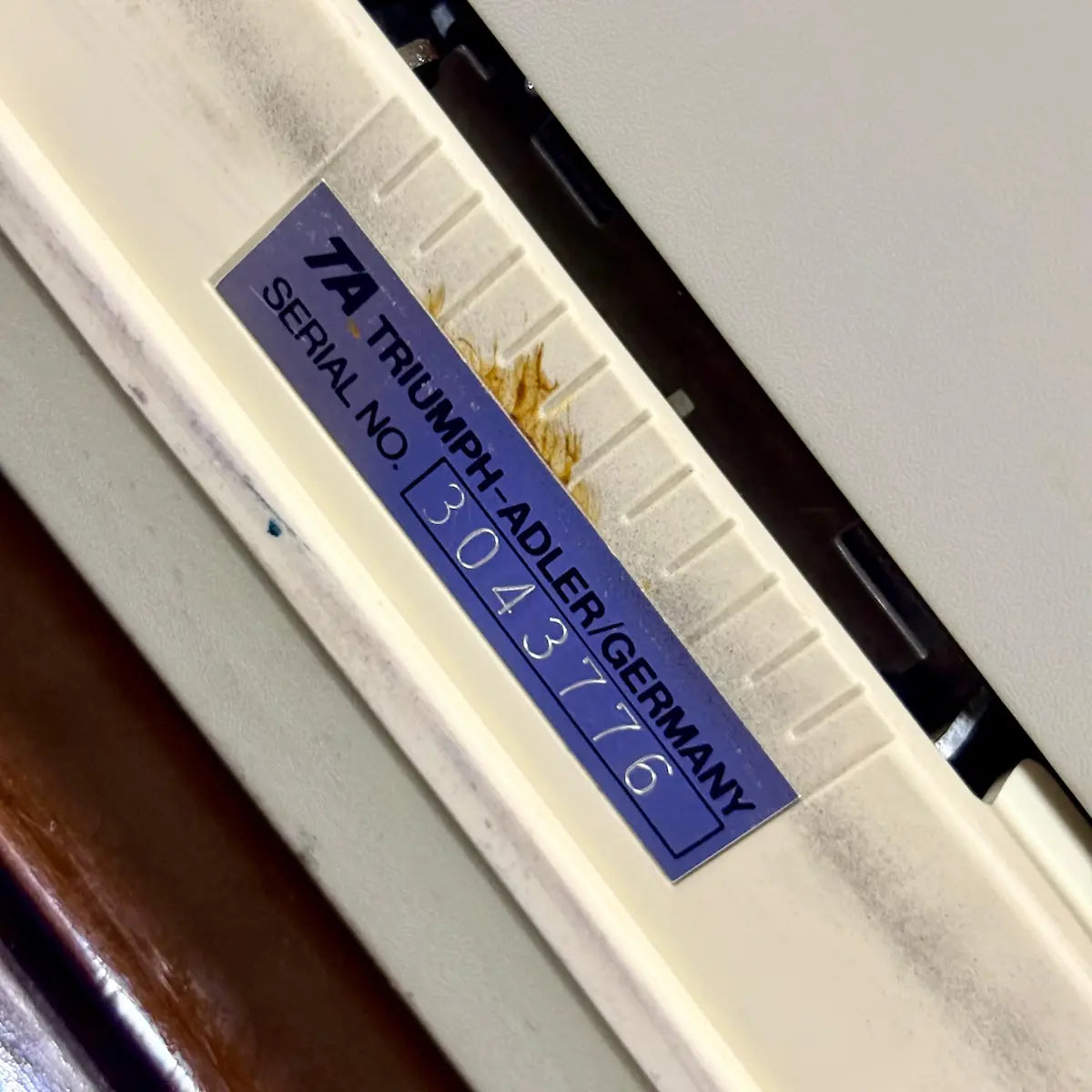 Royal Junior manual English typewriter close-up of Royal model badge on cream body, from RR Typewriter Mart.