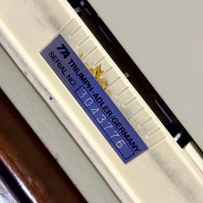 Royal Junior manual English typewriter close-up of Royal model badge on cream body, from RR Typewriter Mart.