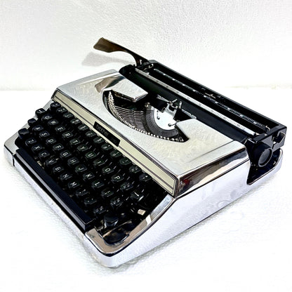 Brother 210 chrome typewriter with black keys, reflective body and restored mechanical typing action in India