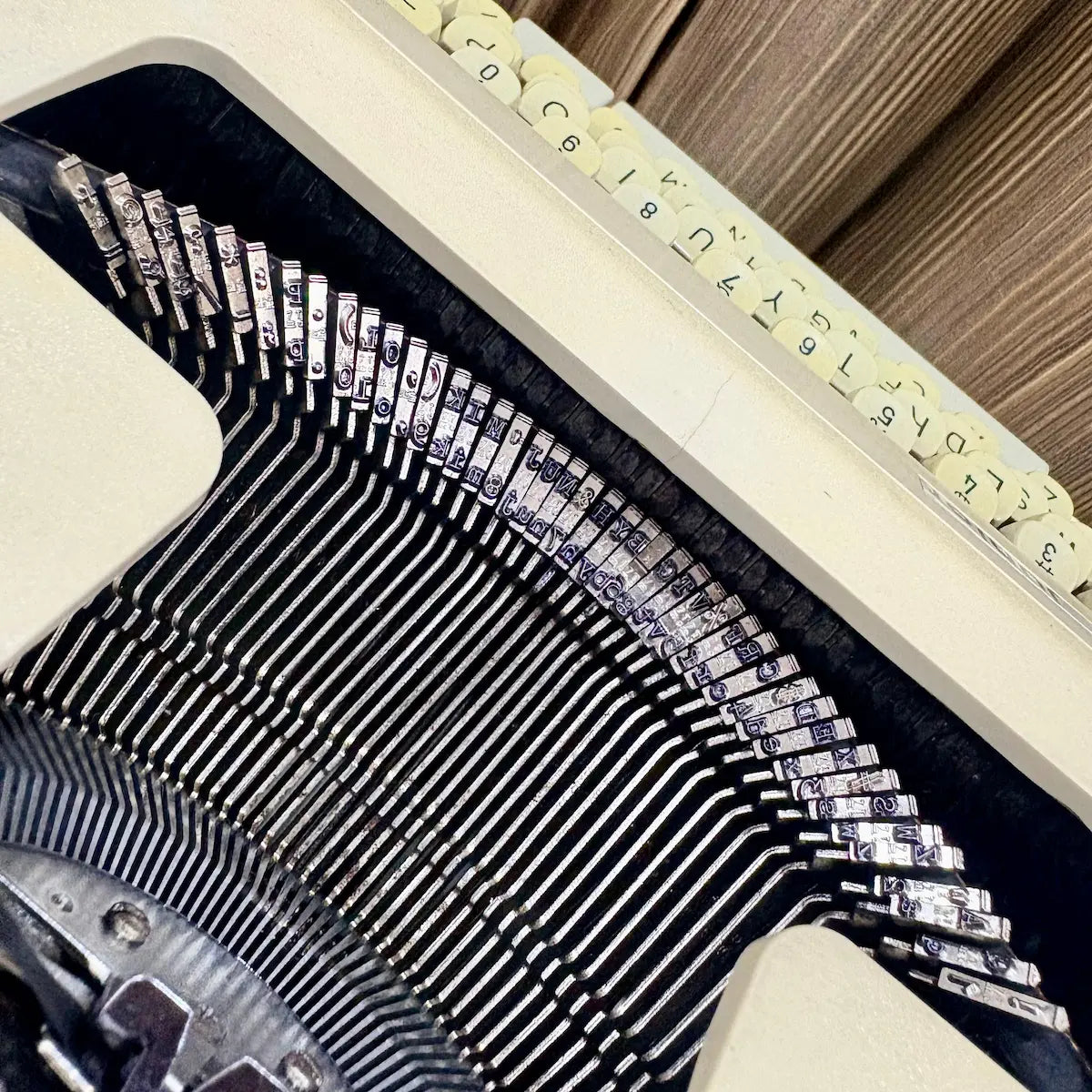 Royal Junior semi portable typewriter close-up of platen, paper support and carriage, from RR Typewriter Mart.