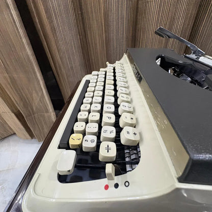 Shop Kovac M-101A Japanese portable typewriter, featuring a classic cream keyboard, original grey panel and ivory body | RR Typewriter Mart