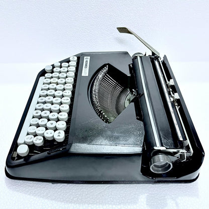 Black Shadow Hermes Baby portable typewriter, vintage manual writing machine for collectors, RR Typewriter Mart online