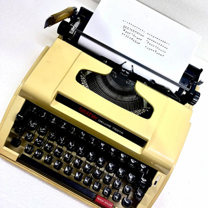 Brother 750TR Arabic portable typewriter showing genuine Arabic keyboard and mechanical typeface, available from RR Typewriter Mart