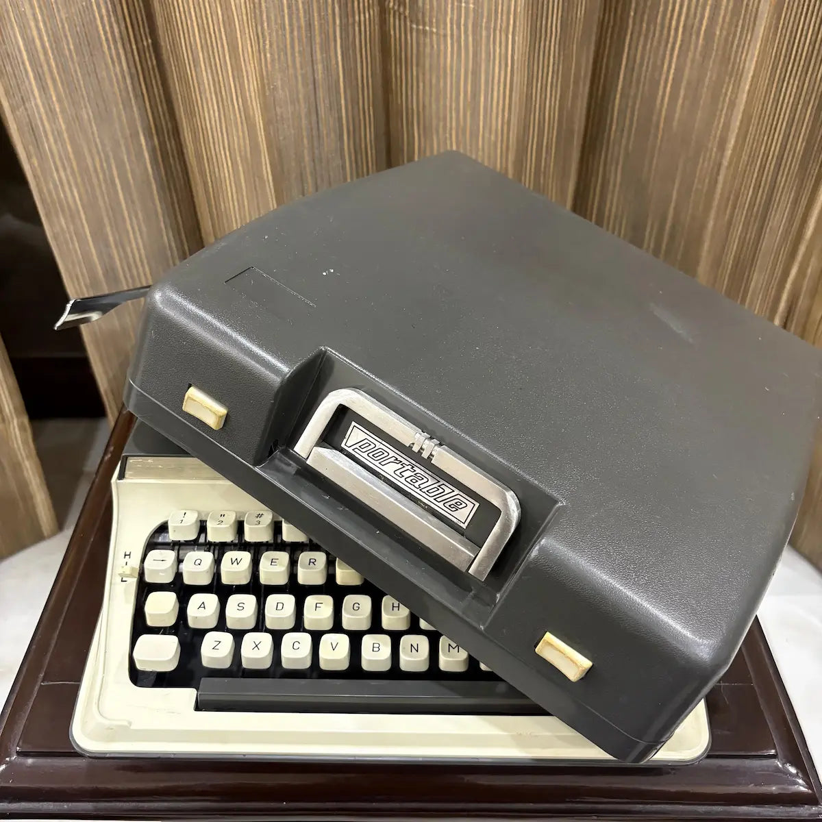 Kovac M-101A Japanese manual typewriter in original grey and ivory white, featuring vintage styling and cream keys | RR Typewriter Mart