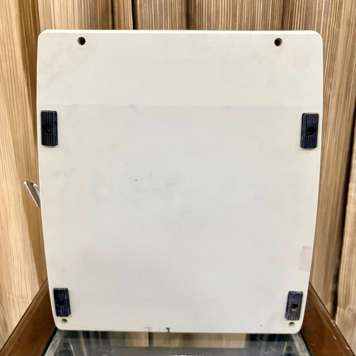 Royal Junior semi portable typewriter underside showing cream base and rubber feet, from RR Typewriter Mart.