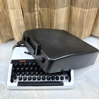 Brother 220 Deluxe Pearl White portable typewriter with QWERTY keyboard and mechanical typing system, ready for writing across India