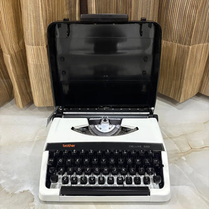 Brother Deluxe 220 Pearl White typewriter with black keyboard and compact mechanical design, restored by RR Typewriter Mart in India