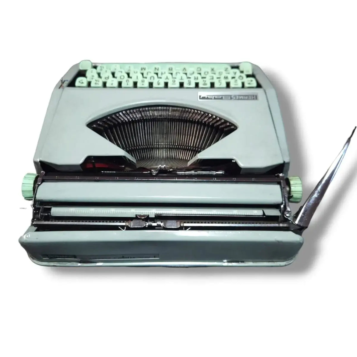 Rear view of Hermes Baby Typewriter showing carriage and typebars, vintage imported typing machine from Hermes