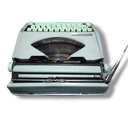 Rear view of Hermes Baby Typewriter showing carriage and typebars, vintage imported typing machine from Hermes