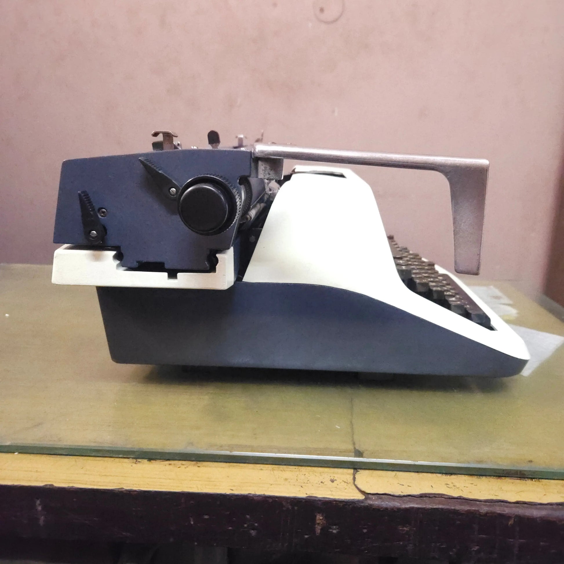 Left side profile of Godrej PB Standard English typing machine with carriage lever and original finish