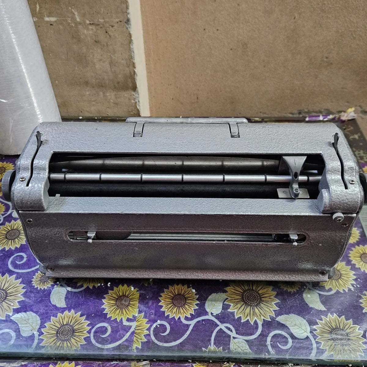 Rear view of Perkins Braille Typewriter showing paper feed assembly, braille typing machine for schools and users