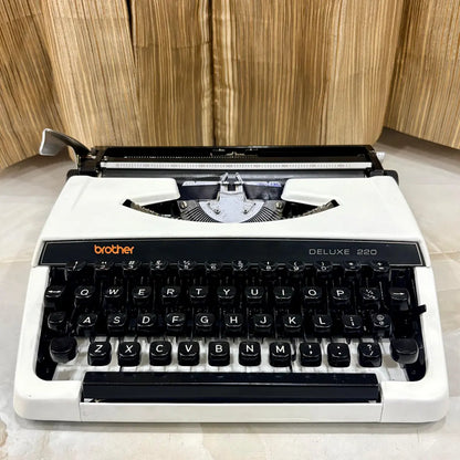 Pearl White Brother Deluxe 220 typewriter with black keyboard, classic carriage and compact body, restored for collectors in India