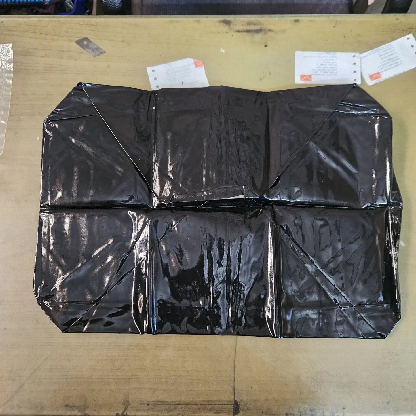 Opened black rexine typewriter dust cover laid flat for foolscap carriage machines and typing machine maintenance