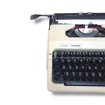 Godrej Prima Traveller manual typewriter detail showing model badge, English keyboard, typebars and carriage lever