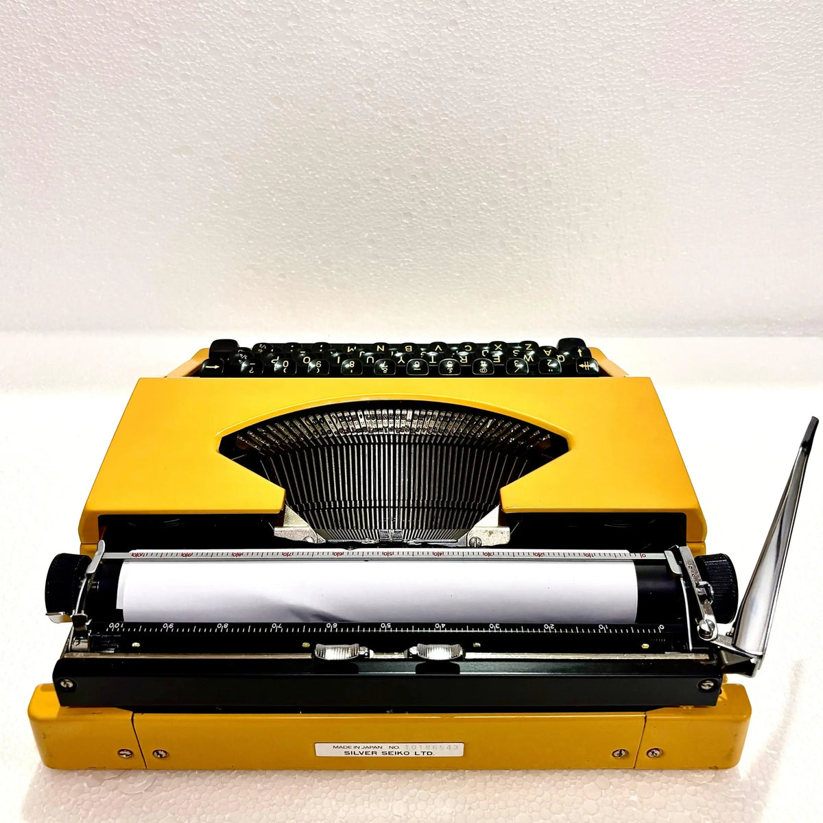 Rear view Silver Reed Typewriter with paper loaded, Japanese portable typewriter from RR Typewriter Mart