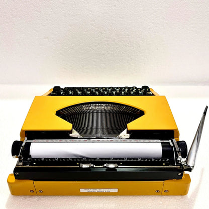 Rear view Silver Reed Typewriter with paper loaded, Japanese portable typewriter from RR Typewriter Mart