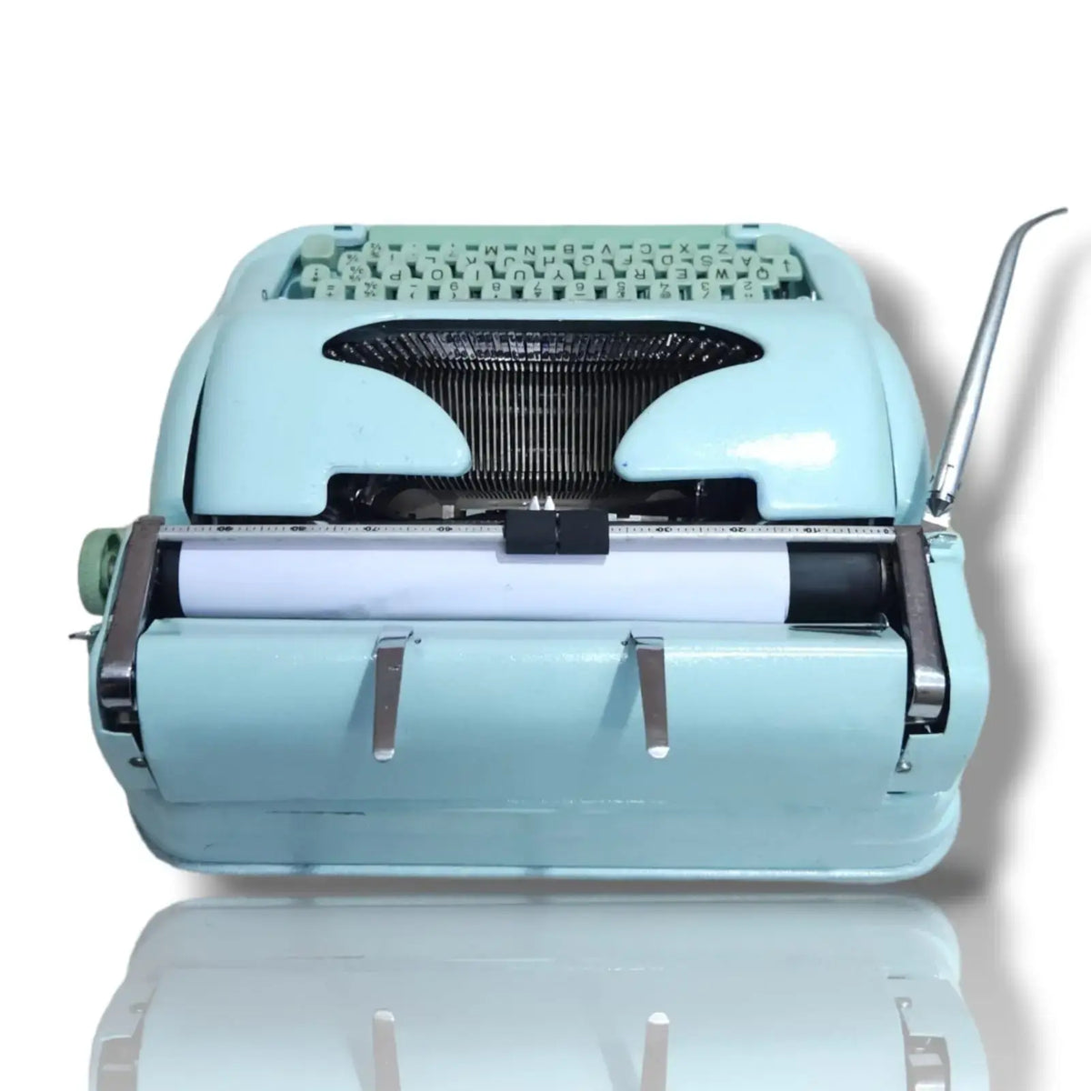 Rear view Hermes 3000 mint green portable typing machine with paper rest and Swiss metal body
