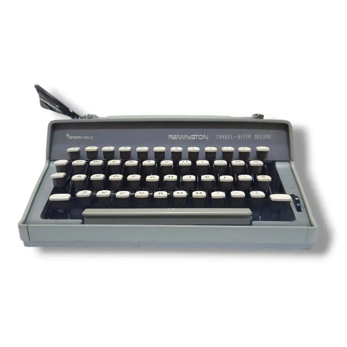 Vintage Remington Travel-Writer Deluxe manual typewriter, low front view showing cream keys and compact design