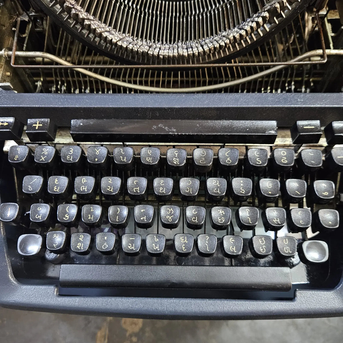 Close-up of original Godrej keytops on Gujarati Typewriter machine