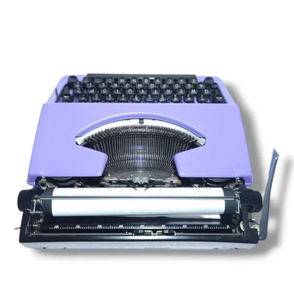 Rear angle view of restored Brother Charger 11 portable typewriter made in Japan