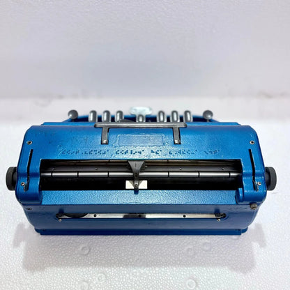 Rear view of Perkins Braille Typewriter showing paper feed system and manual Braille typing machine design