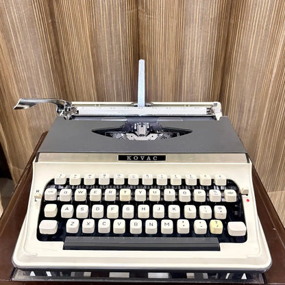 Vintage Kovac typewriter in original grey and ivory white, a distinctive addition to a classic mechanical typewriter collection | RR Typewriter Mart