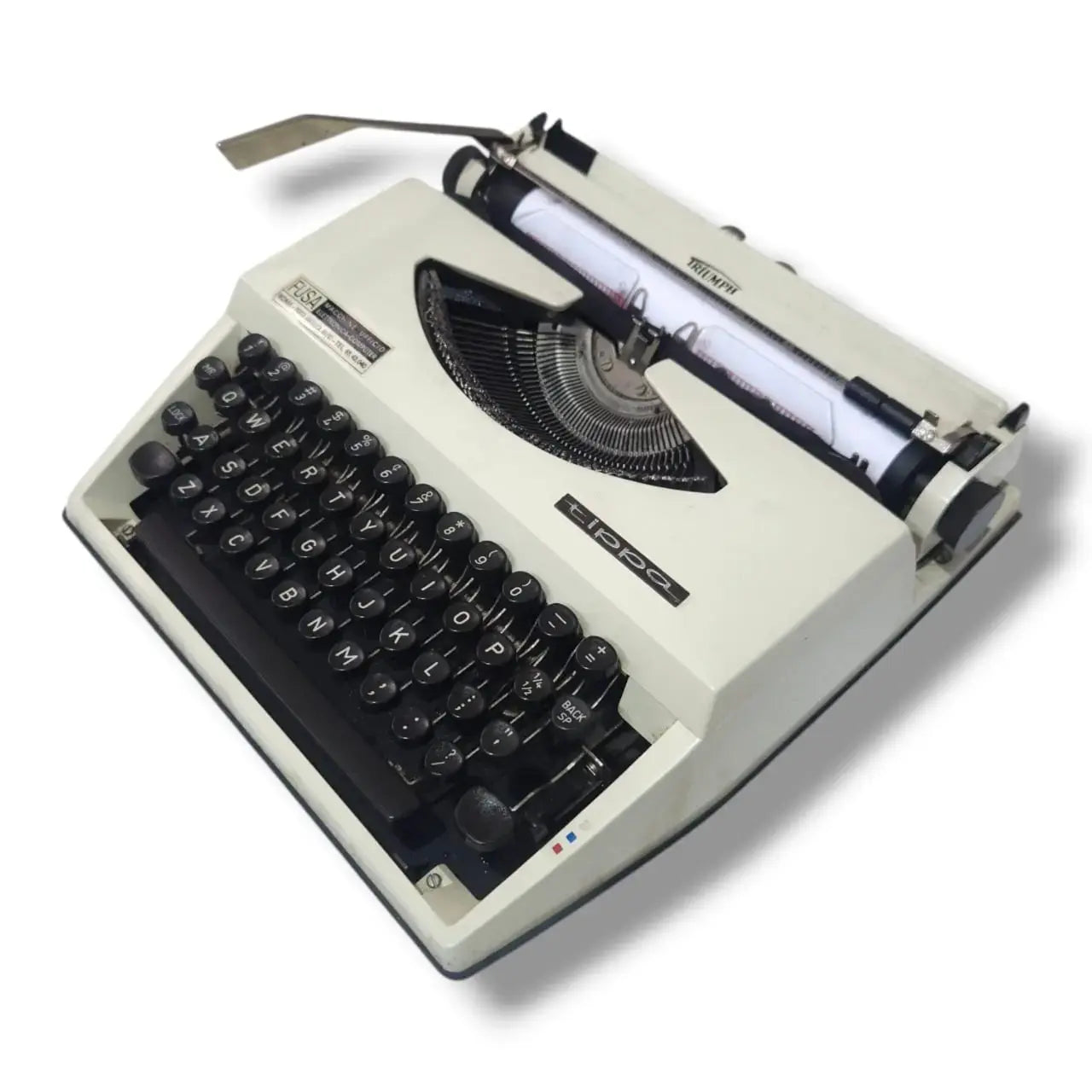 Adler Tippa Triumph portable typewriter angled view showing cream body, black keyboard, typebars and carriage