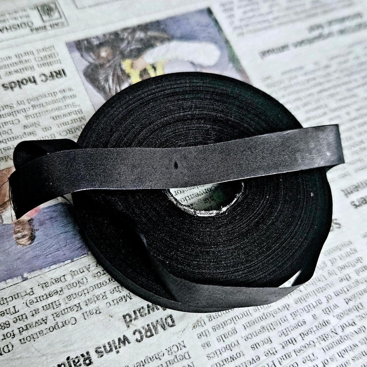 Close view of black typewriter ribbon roll fabric, ribbon for typing machine from ribbon roll store