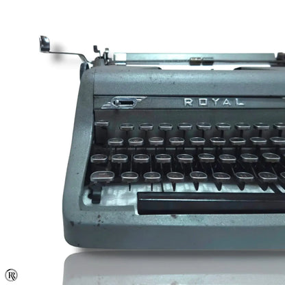 Royal Quiet Deluxe typewriter close-up showing Royal logo and mechanical keyboard for vintage typing