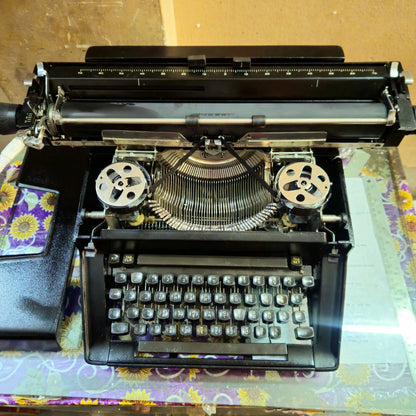 Remington typewriter with open ribbon cover showing mechanism, Hindi typewriter store restoration