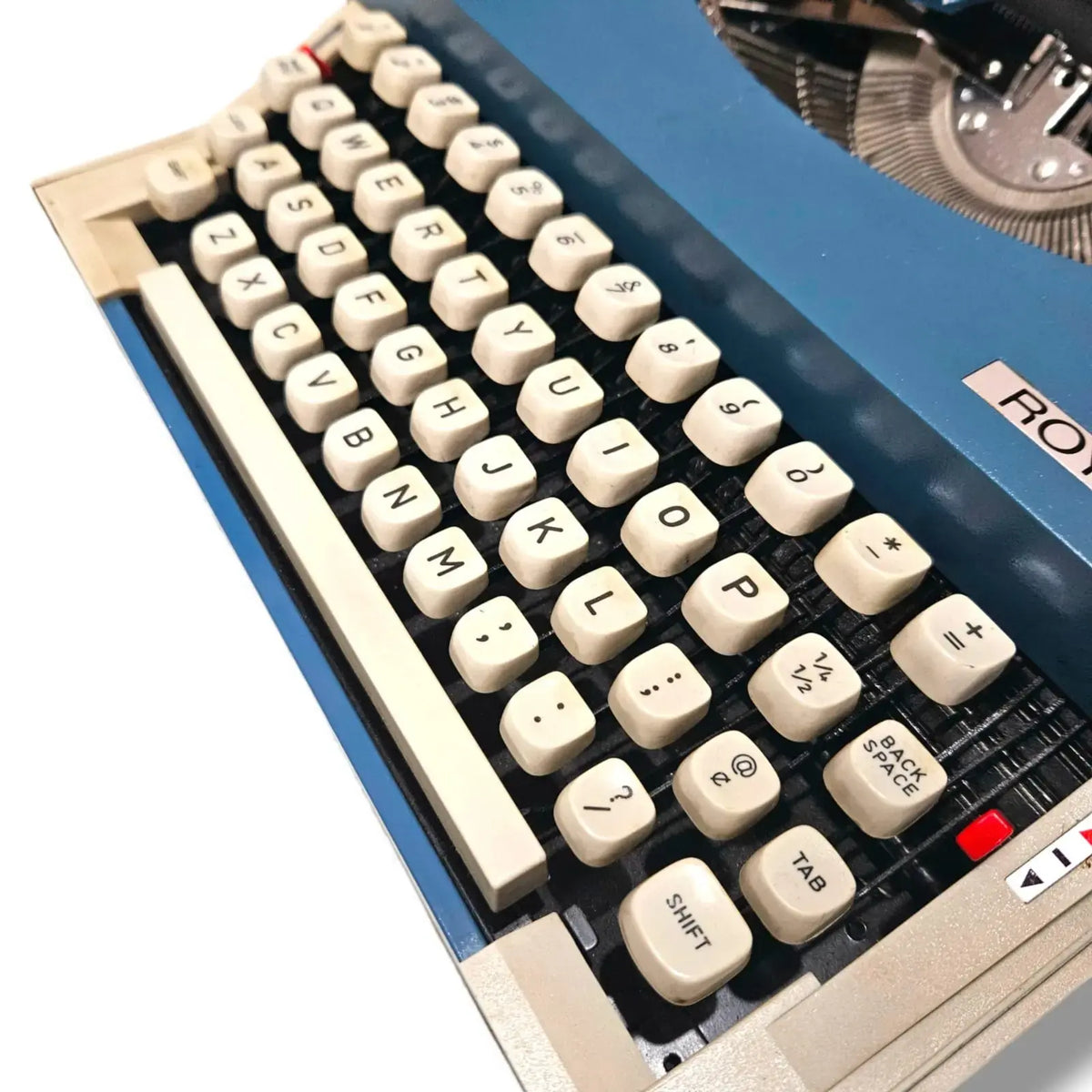 Close-up of Royal Sprite manual typewriter keyboard showing vintage QWERTY keys and typing layout
