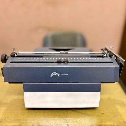 Professionally serviced Godrej English Typewriter from RR Typewriter Mart, showing the unique handwriting-print mechanism.