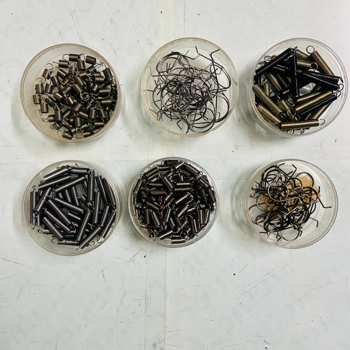 Collection of manual typewriter springs sorted by type for restoration, typewriter parts store RR Typewriter Mart