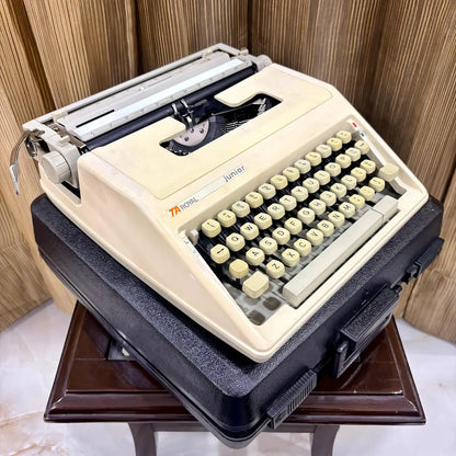 Royal Junior manual English typewriter in hard carrying case, angled view, from RR Typewriter Mart.