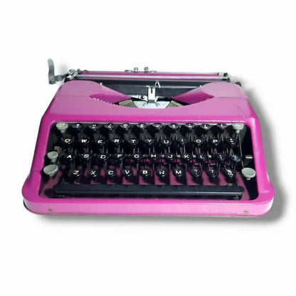 Vintage pink Hermes typewriter portable typing machine from trusted imported typewriter seller