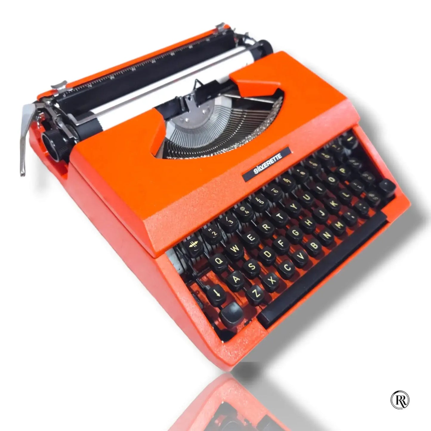 Front right view of Silver Reed Silverette II manual English typing machine in Cosmic Orange by RR Typewriter Mart