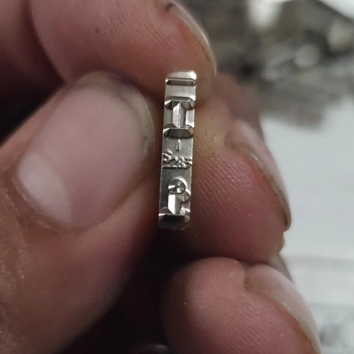 Side profile of English Long Motion Typeface I replacement type slug for manual typewriter repair and restoration